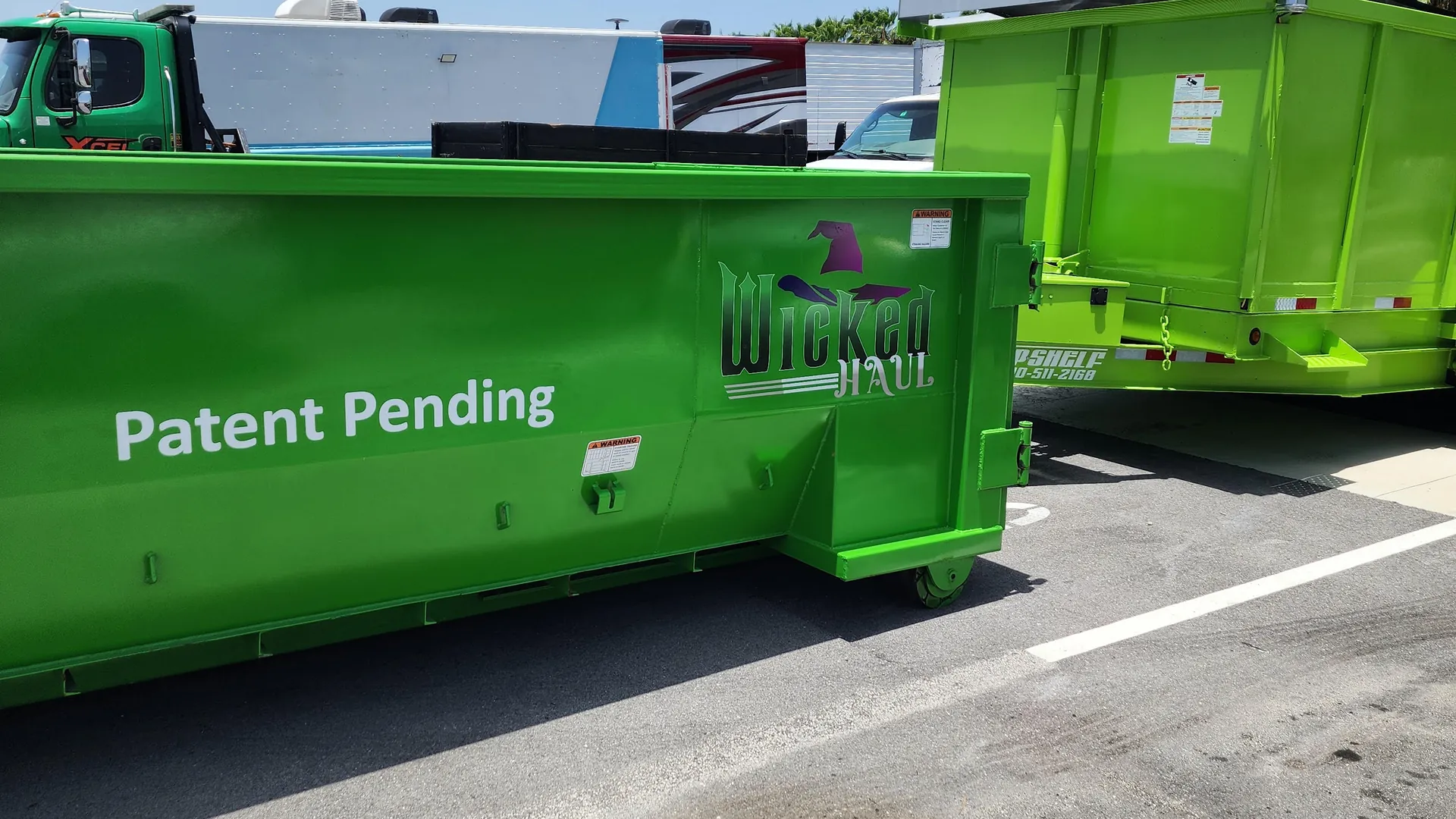 Green Wicked Haul dumpsters ready to go out